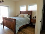 Master Bedroom with queen size bed, attached full bathroom , unsurpassed beach view and direct access to the upper deck        